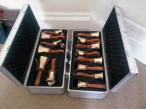 Set of handbells in carrying cases